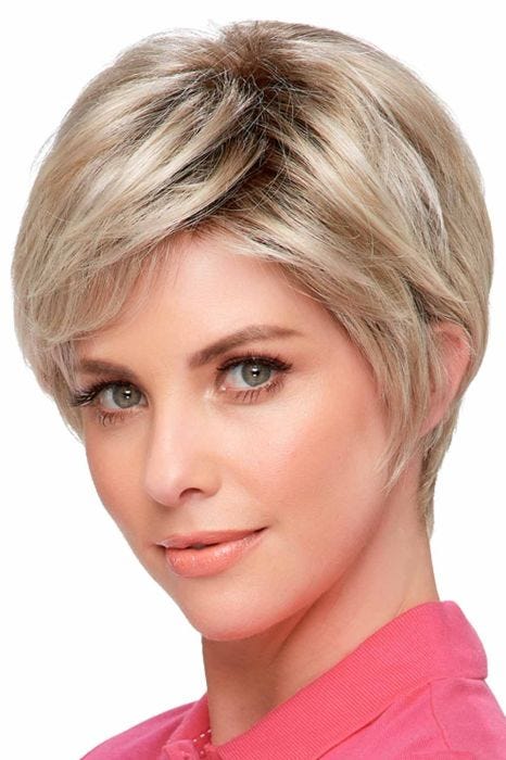 Woman in a light ash blonde asymmetrical pixie wig with long layers