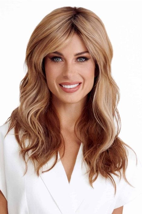 Woman in an extra long red blonde wig with beach waves and curtain bangs