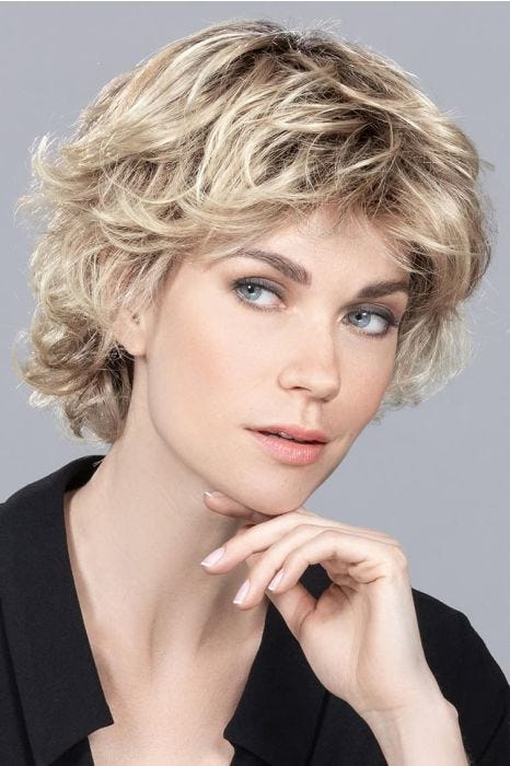 short tousled wavy wig with layers