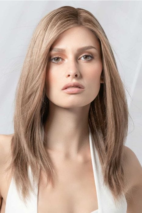 Woman in an extra long blonde blunt cut wig