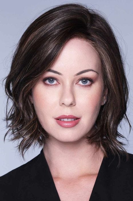 Woman in a dark brown chin length curly layered lace front bob wig