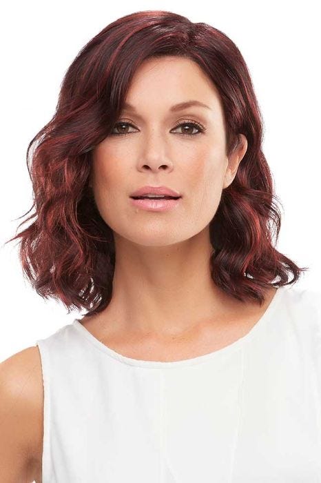 Woman in a wavy shoulder length black and red lace front wig