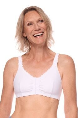 Woman in a white front closure bra for post surgery care