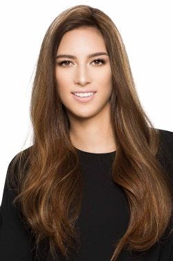 Woman in a 22" top 24" reddish brown human hair topper for thinning hair