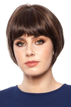 Woman in a chin length medium brown rounded bob wig with blunt bangs