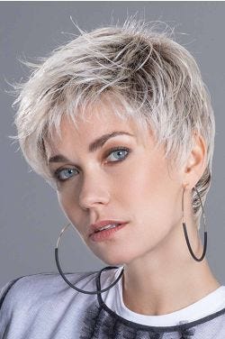 Woman in a short tousled platinum blonde lace front pixie wig