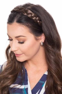 Woman with brown hair in a matching braided hair headband