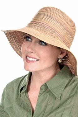 Woman in textured brimmed sun hat with multiple colors woven through