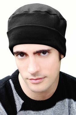 Man in black organic cotton cuffed beanie chemo cap