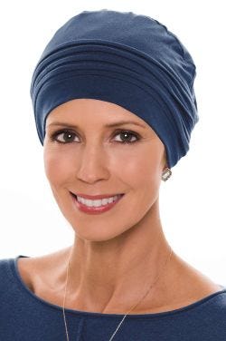 Woman in navy bamboo chemo cap