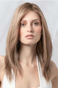 Woman in an extra long blonde blunt cut wig