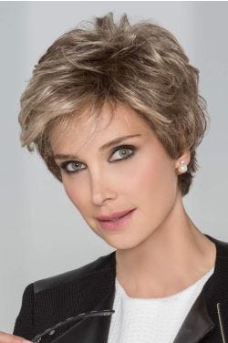 Woman in a choppy dark blonde layered lace front pixie wig