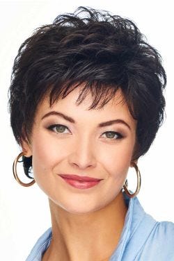 Woman in a classic curly semi-long black pixie wig with light fringe bangs