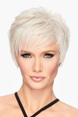 Woman in a shaggy light grey pixie wig with side bangs