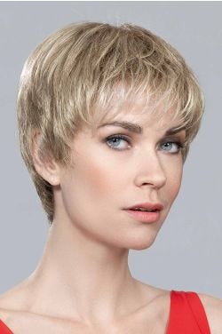 Woman in a medium brown close cropped lace front pixie wig