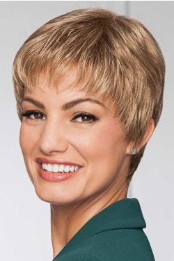 Woman in classic dark blonde straight pixie wig with fringe bangs