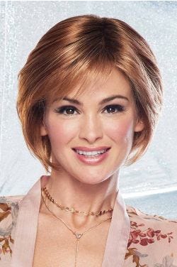 Woman in a medium auburn chin length bob wig with shaped layers and side swept bangs