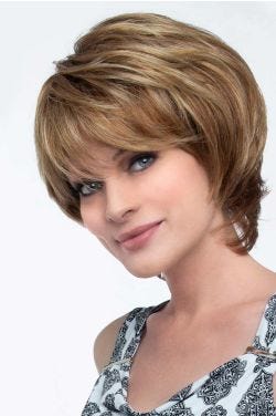 Woman in a short layered red blonde wig with side bangs