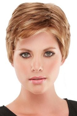 Woman in blonde, short pixie wig with layers and bangs