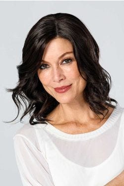 Woman in a 12" wavy dark brown lace front hair topper for thinning hair