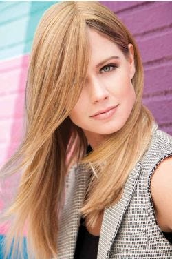 Woman in a 11" to 14" light auburn hair topper for thinning hair