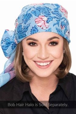 Woman in denim blue floral hand stamped head scarf for cancer patients
