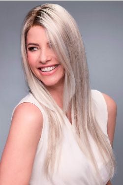 Woman in an extra long ash blonde lace front wig