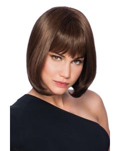 Woman in a straight chin length dark brown wig with blunt bangs