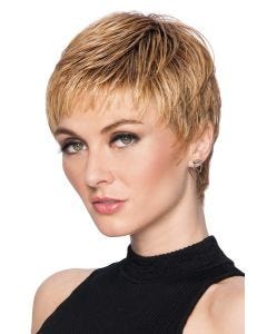 Woman in a reddish blonde textured pixie wig with short bangs