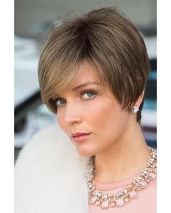 Woman in an extra long light brown pixie wig with side bangs