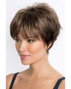 Woman in a shaggy long light brown pixie wig with fringe layers