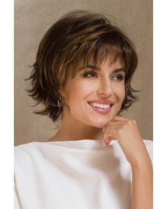 Woman in a large chin length dark brown bob with choppy layers and wispy bangs