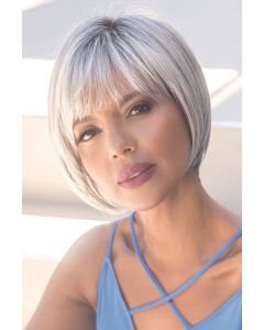Woman in a chin length silver bob wig with fringe bangs