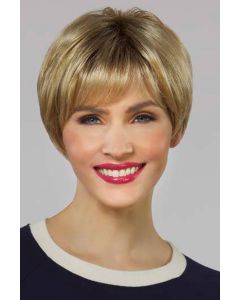 Woman in golden blonde pixie wig with longer layers in the back and wispy bangs