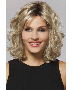 Woman in a shoulder length light blonde curly wig