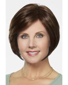 Woman in a chin length medium brown stacked lace front bob wig