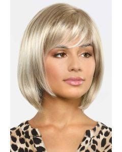 Woman in a past the chin light blonde bob wig with side bangs