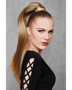 Woman in a reddish blonde 25" ponytail attached to her hair