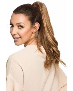 Woman in a 14" light brown curly human hair ponytail hair extension