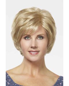 Woman in a chin length light blonde short layered lace front wig