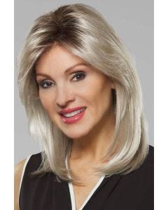 Woman in a shoulder length platinum blonde straight wig