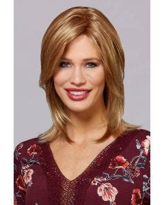 Woman in a shoulder length dark blonde lace front wig with long layers