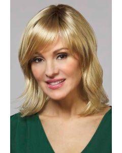 Woman in a shoulder length red blonde wavy lace front wig with side bangs