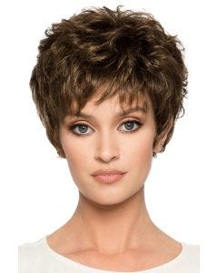 Woman in a long medium brown pixie wig with wispy bangs