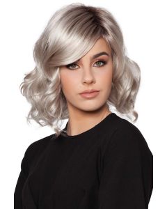 Woman In a shoulder length platinum blonde curly wig