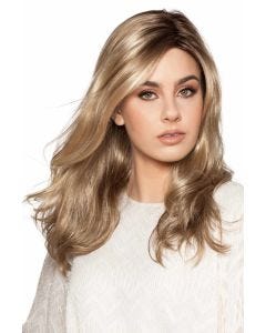 Woman in a past the shoulders wavy light brown lace front wig