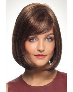 Woman in an angled chin length medium auburn bob wig with side bangs