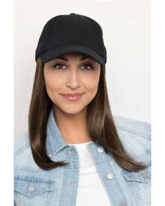 Woman in a solid black baseball cap with extra long deep auburn hair attached
