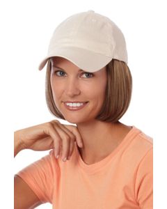 Woman in a solid beige baseball cap with chin length dark strawberry blonde hair attached