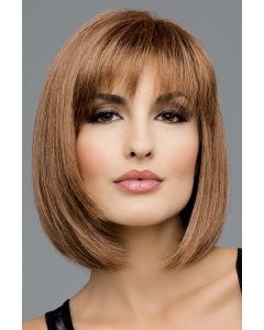 Woman in a shoulder length light brown bob wig with textured bangs